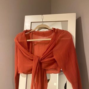 Salmon colored tie front crop top